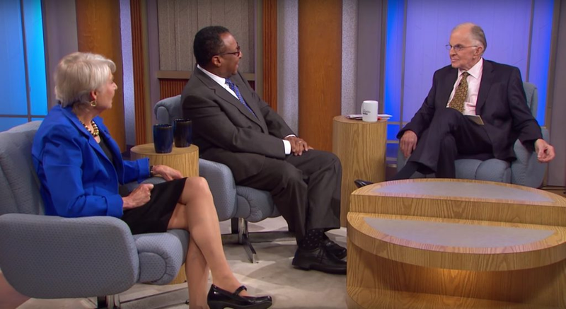 John McLaughlin, host of "The McLaughlin Group", with Eleanor Clift of the Daily Beast and Clarence Page of the Chicago Tribune during a 2015 show. (Credit: Screenshot via PBS.)